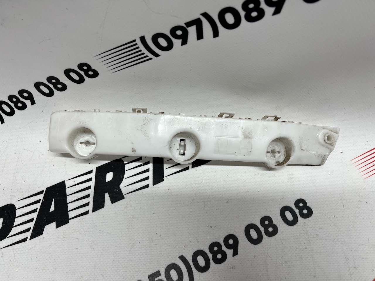 Кріплення переднього бампера ліве оригінал Б/У Nissan X-Trail(Rogue) 2014-2020 (62223-4BA1A)