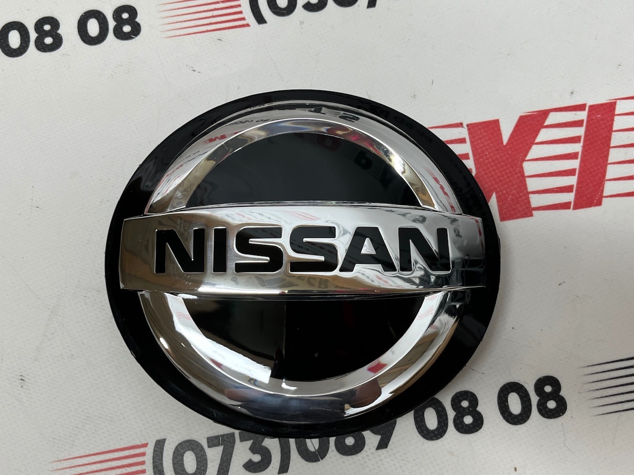 Значок під дістрон Nissan Sentra 2019- (628906LH0A), аналог